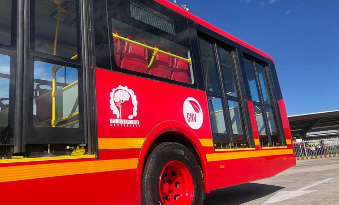 Transmilenio urban bus with label of GNV (natural gas vehicle).