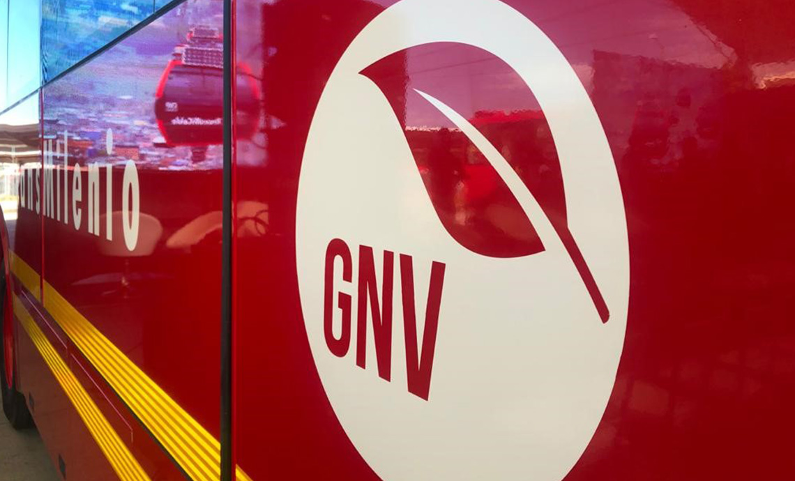 Transmilenio urban bus with label of GNV (natural gas vehicle).