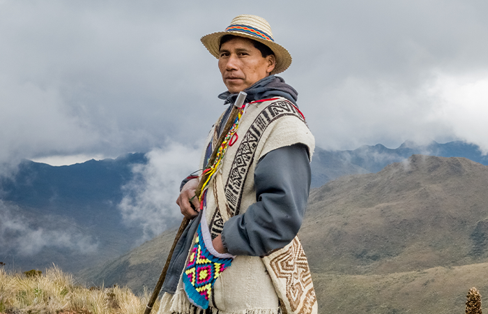 Peasant with his ruana and hat.