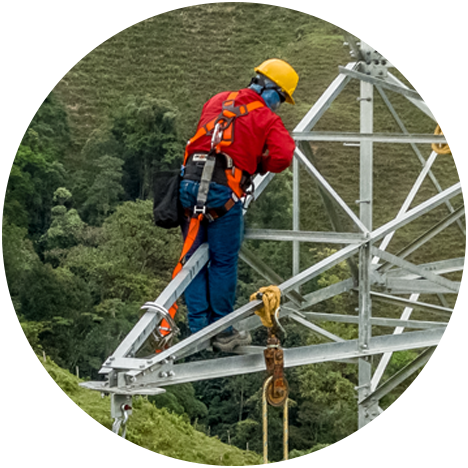 Employee working at heights on a steel structure using all personal protection equipment.