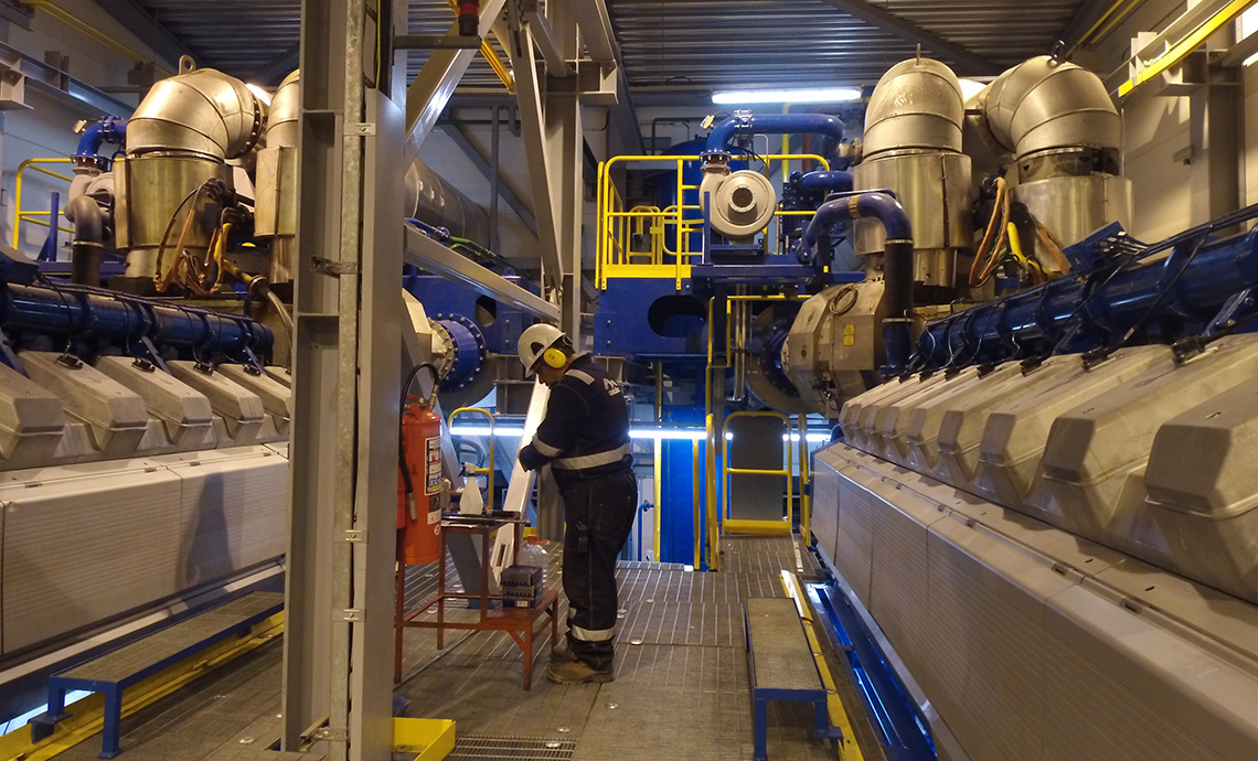 Worker inside an electric energy generation plant.