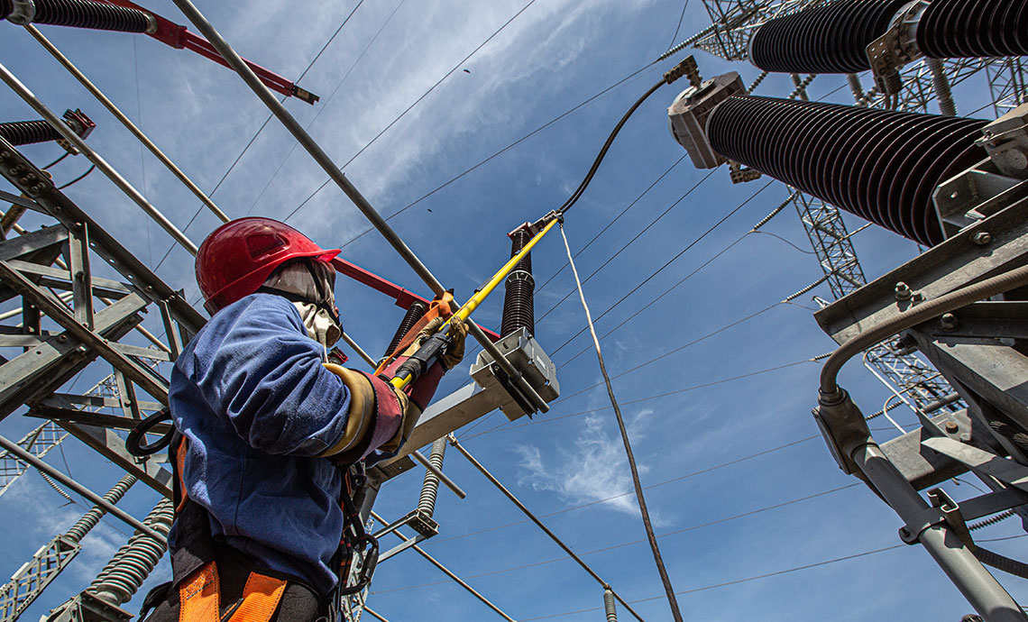 Employee working at heights at infrastructure.
